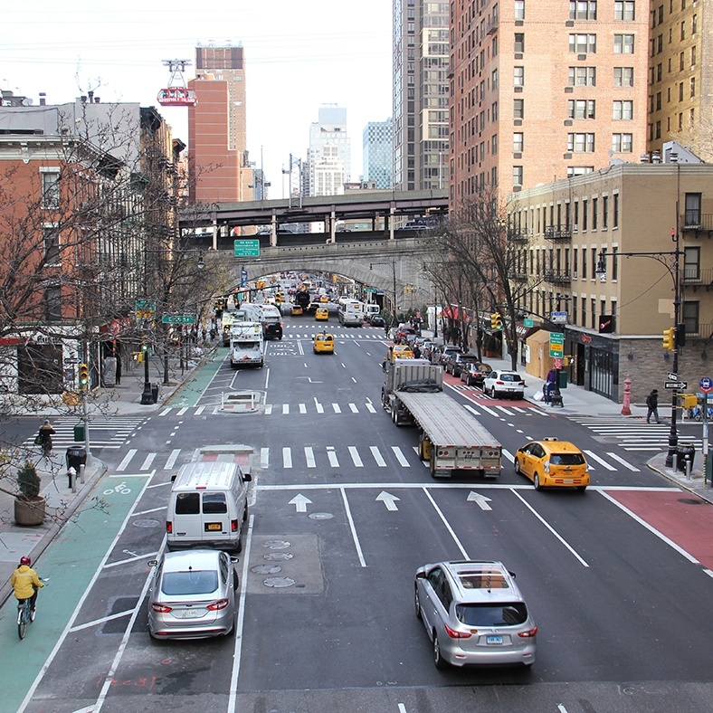 Aerial view of street with bus lane and protected bike lane