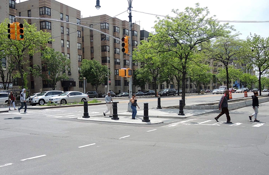 Pedestrians crossing a wide pedestrian island