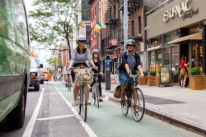 ​​Bicyclists riding in a protected lane
